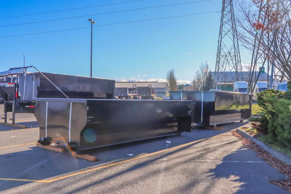 Roll-off dumpster ready for waste disposal at job site for Concrete Dumpster Rental in Reedurban